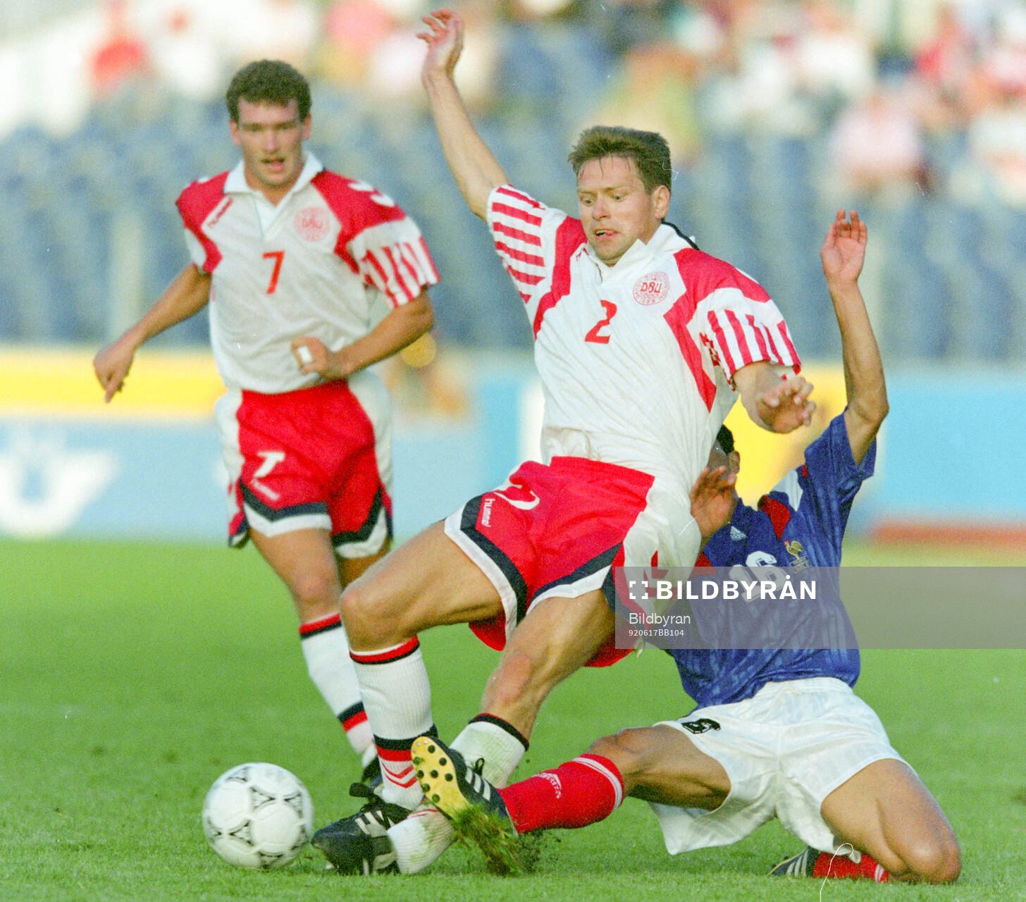 Denmarks John Sivebaek against France‚Äôs Pascal Vahirua
