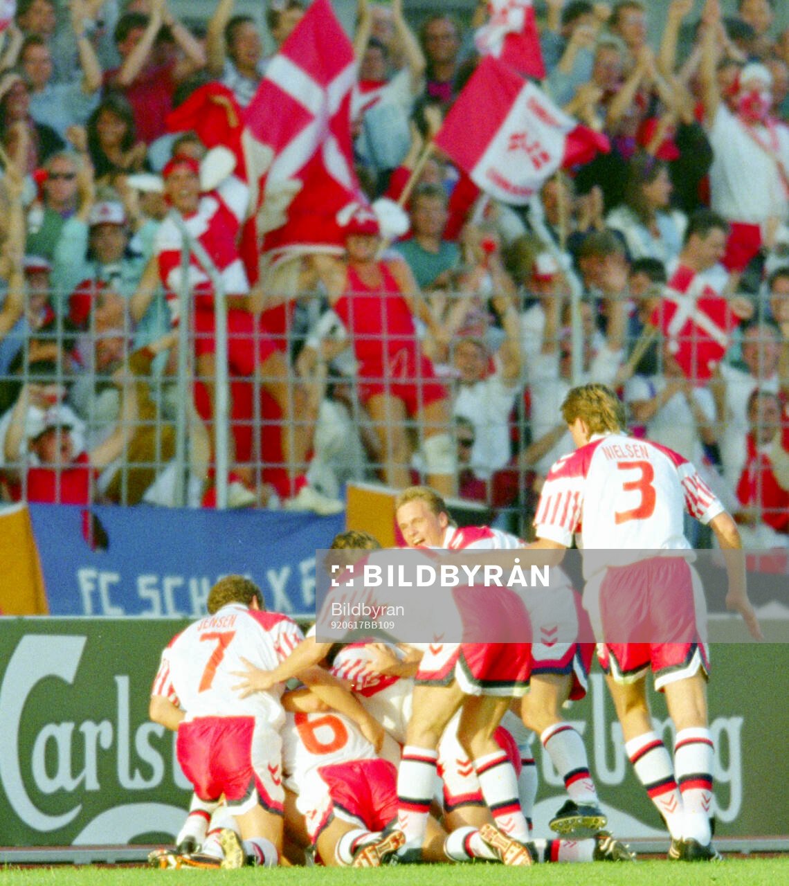 Denmarks players celebrates Lars Elstrups winning 2-1 goal