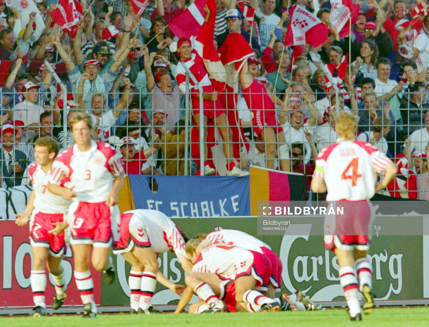 Denmarks players celebrates Lars Elstrups winning 2-1 goal