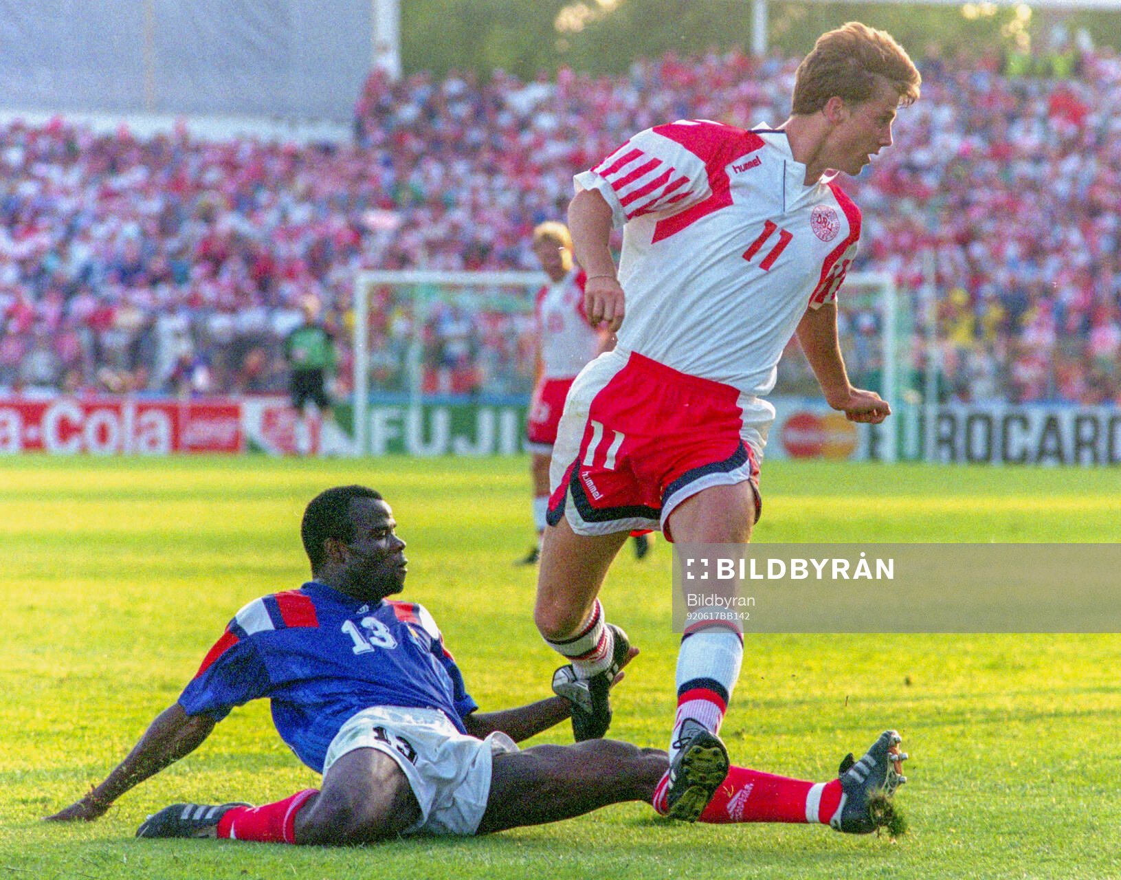 Denmarks Brian Laudrup against Basile Boli of France