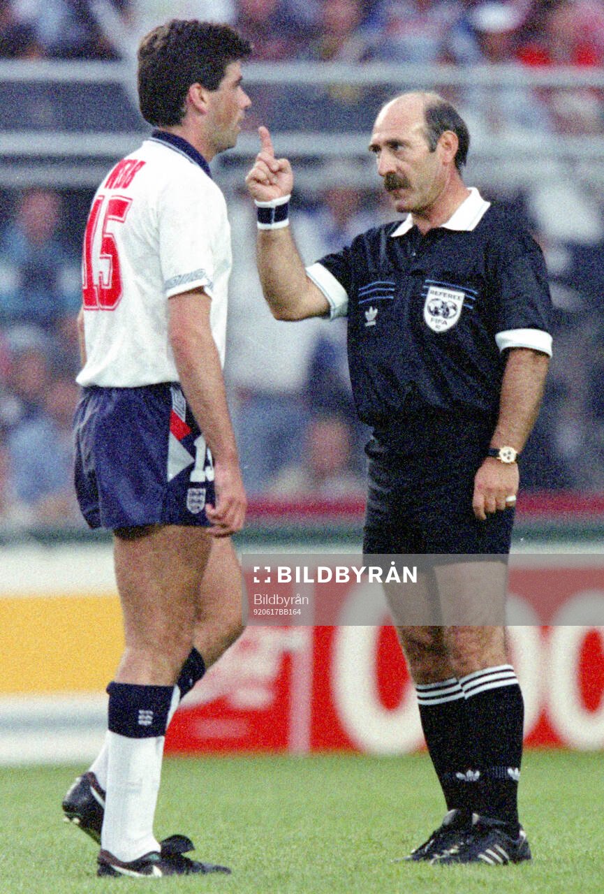 Referee Jose dos Santos and Englands Neil Webb