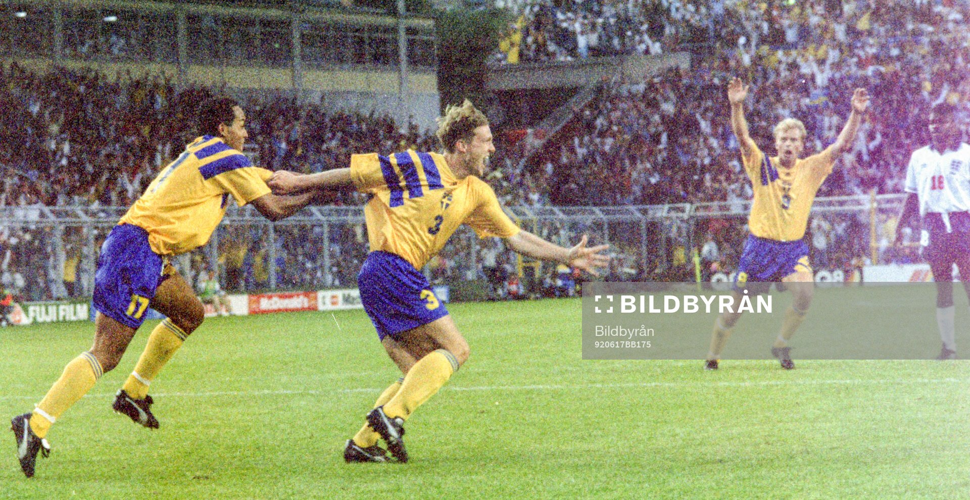 Swedens Jan Eriksson (C) celebrates his equalizing goal for