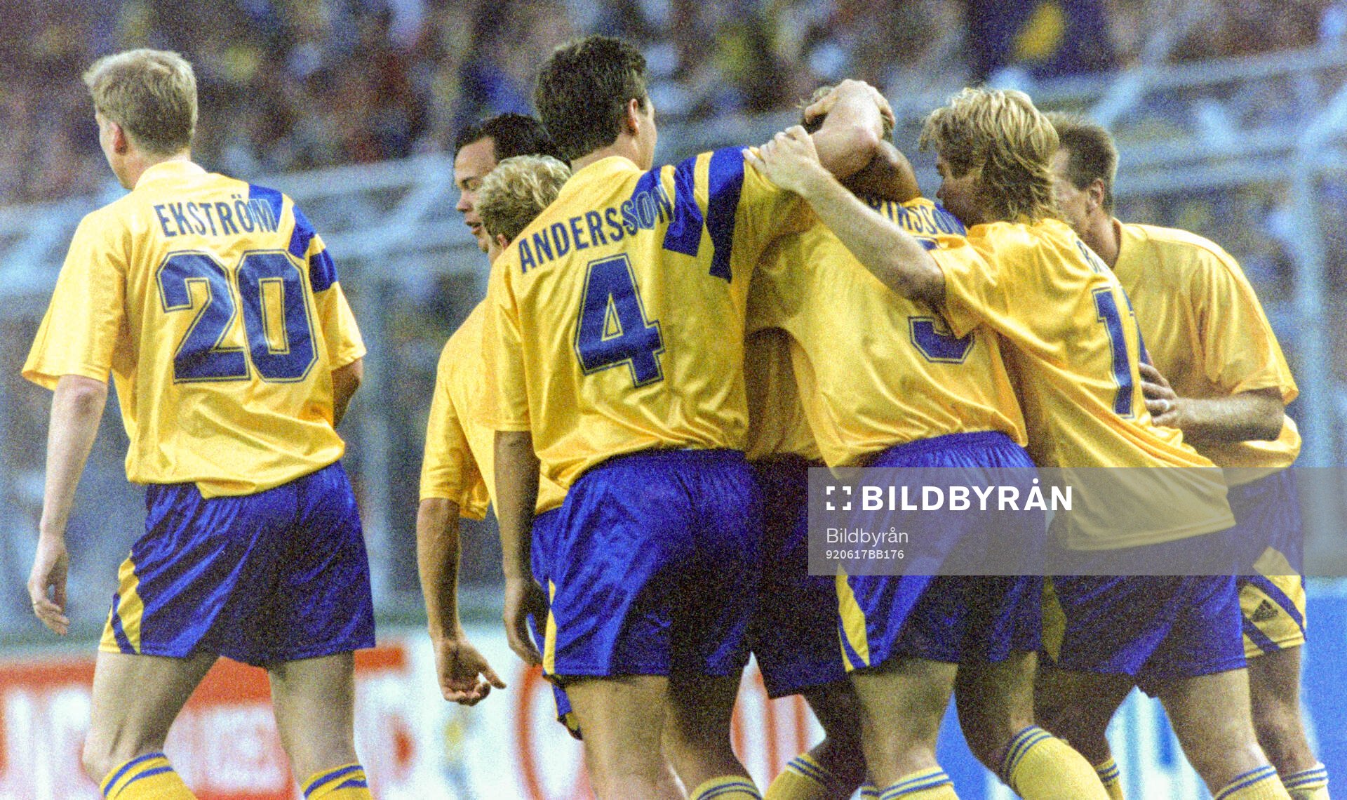 Swedens Jan Eriksson (# 3 centre) celebrates his equalizing