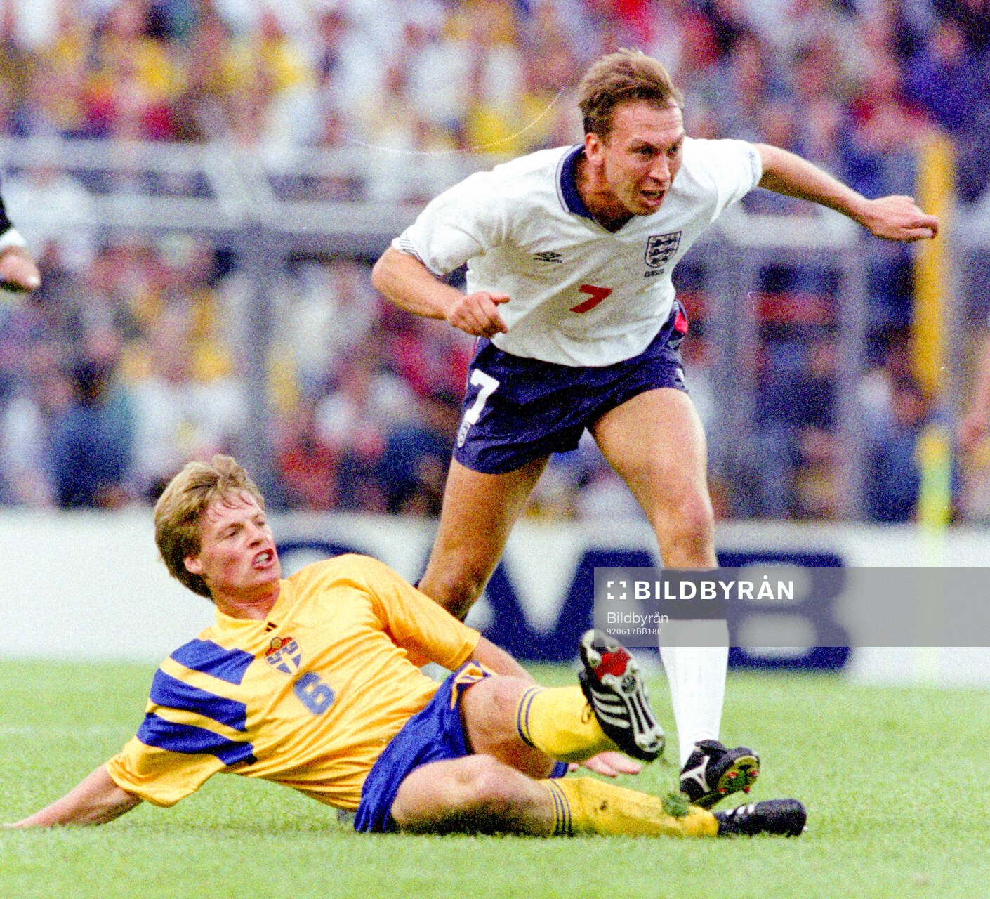 Swedens Stefan Schwarz tackles Englands David Platt