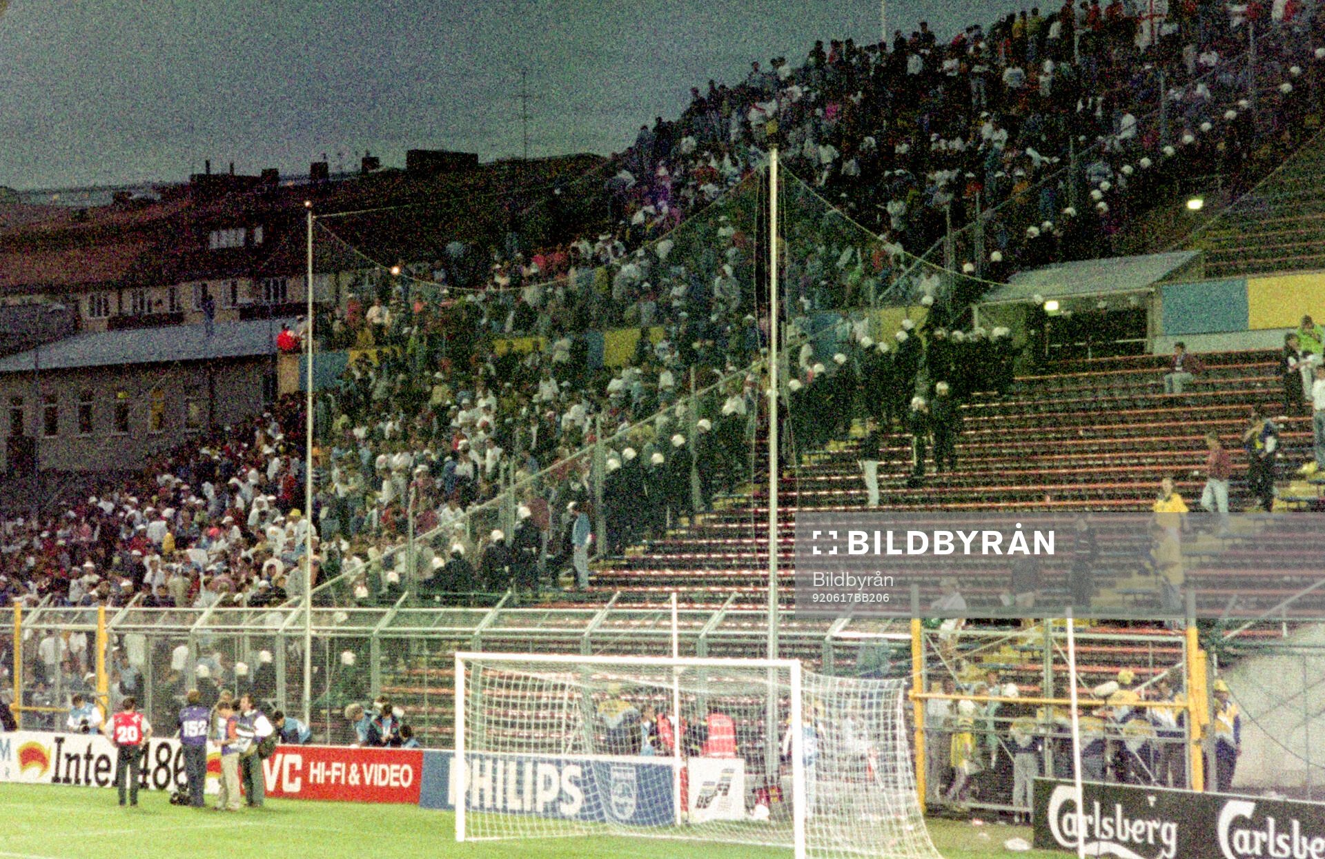 English fans in the stands at Rasunda Stadium are watched