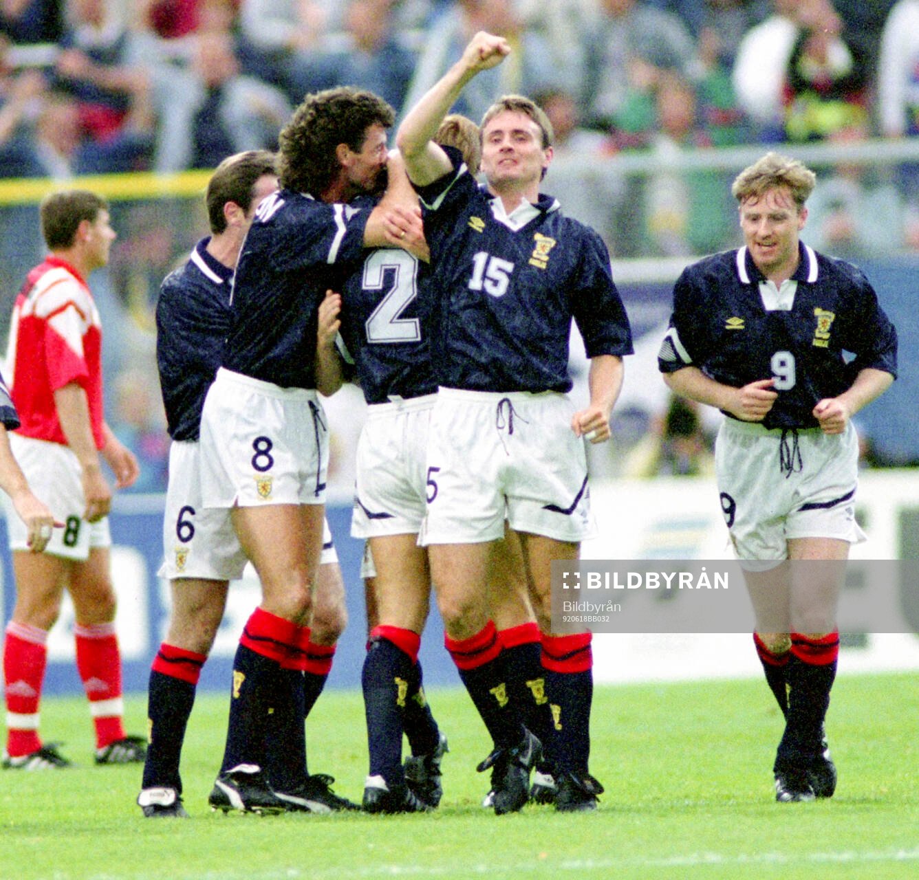 Scotlands Paul McStay (not visible) celebrates his 1-0 goal