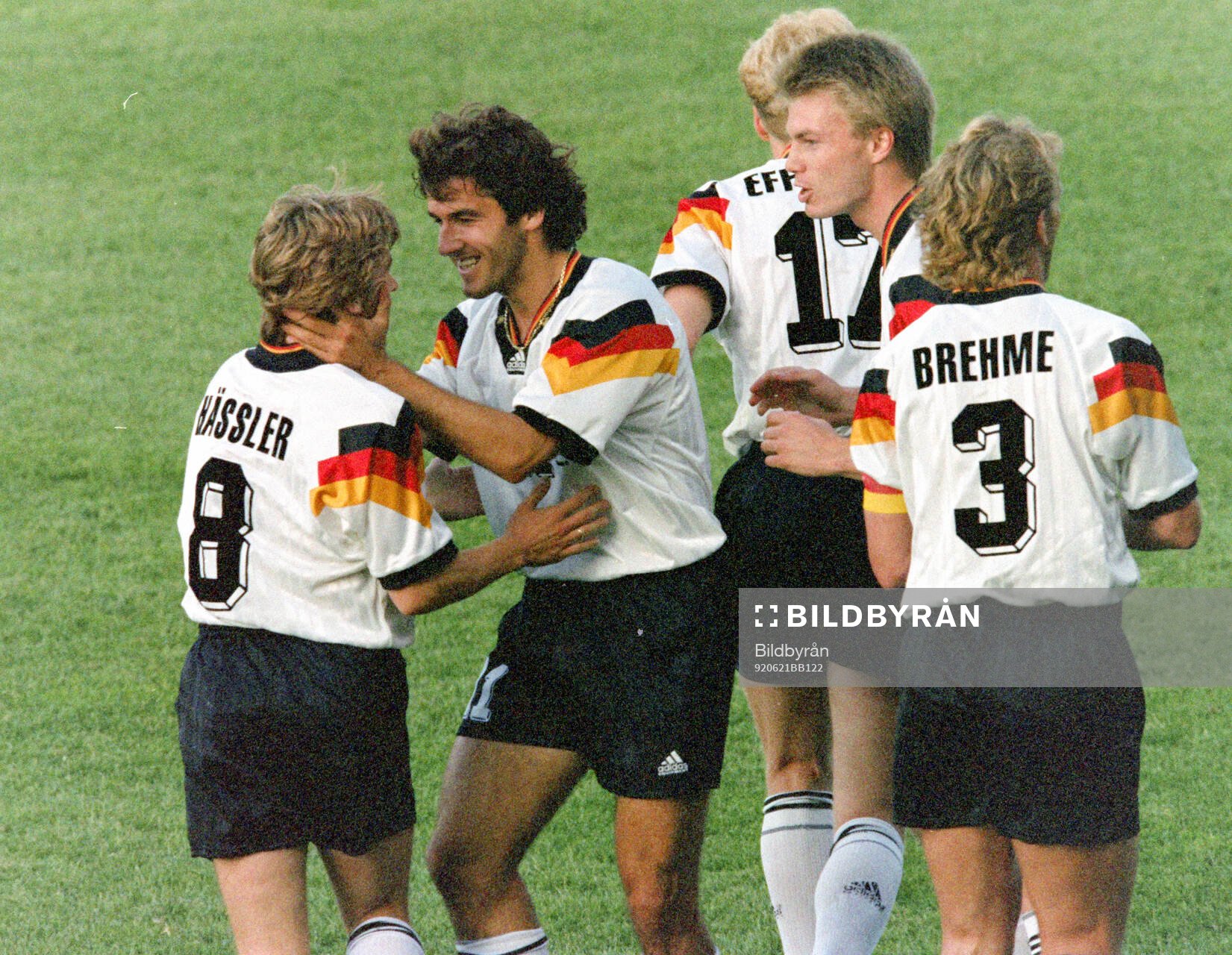 Thomas Hassler of Germany (L) celebrates his goal for 1-0
