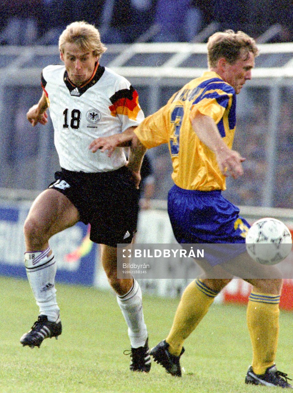 Jurgen Klinsmann of Germany against Jan Eriksson of Sweden