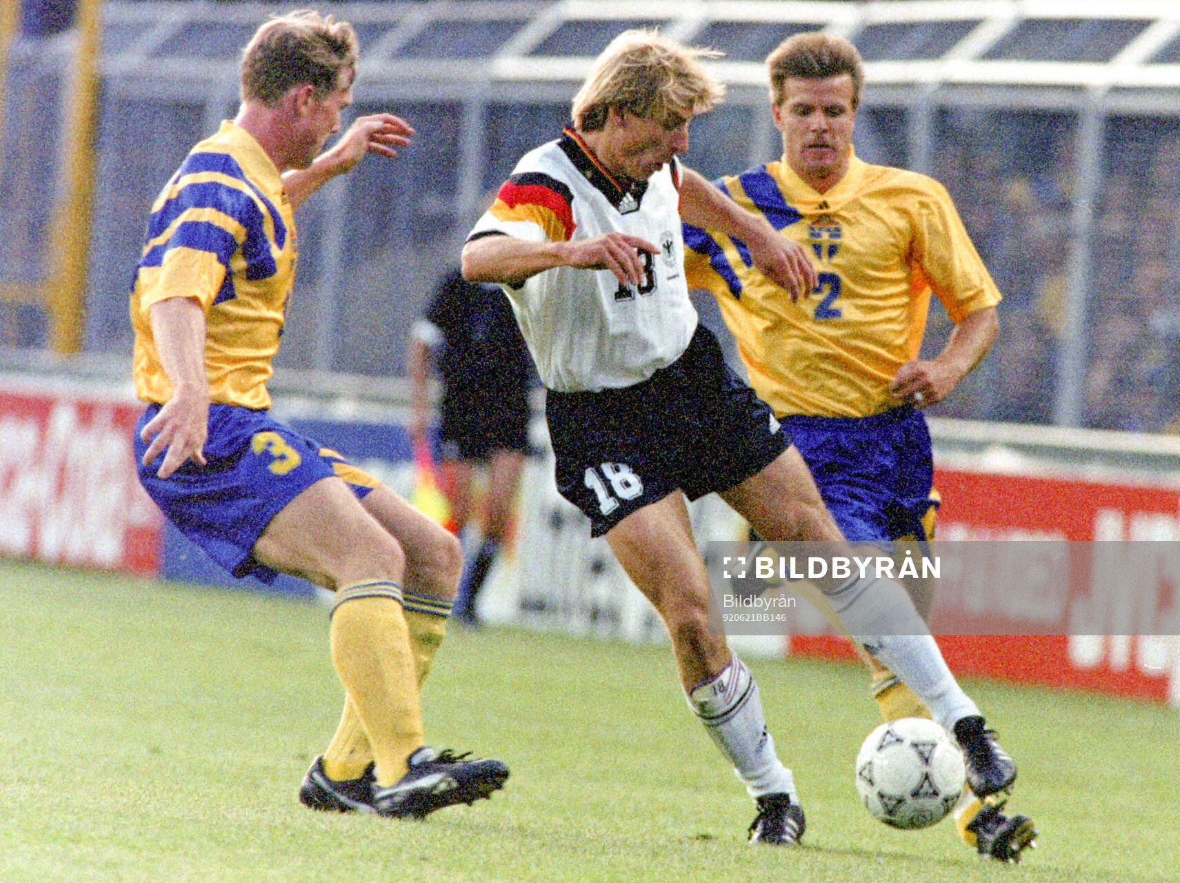 Jurgen Klinsmann of Germany against Jan Eriksson (L) and