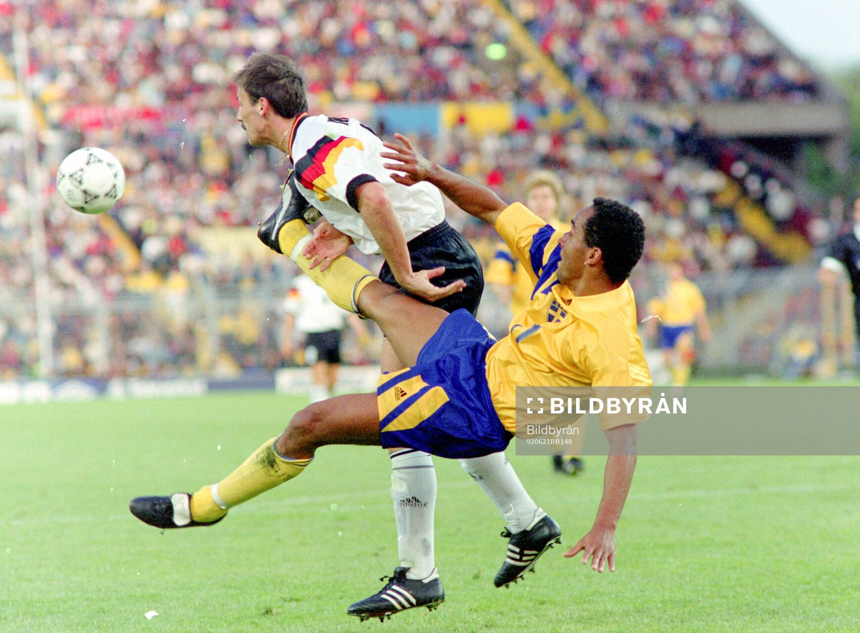 Martin Dahlin of Sweden against Jurgen Kohler of Germany
