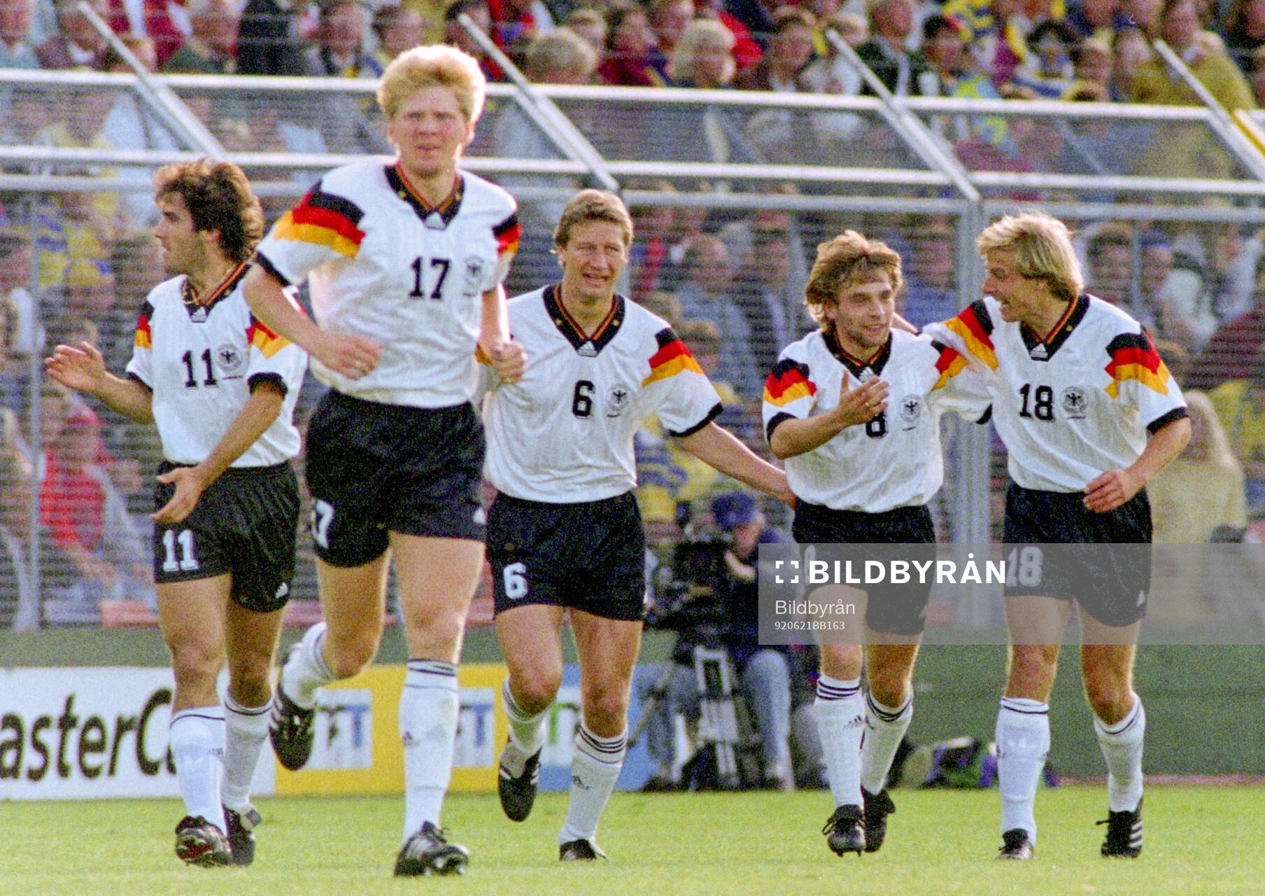 Germanys Thomas Hassler (2nd R) celebrates his 1-0 goal