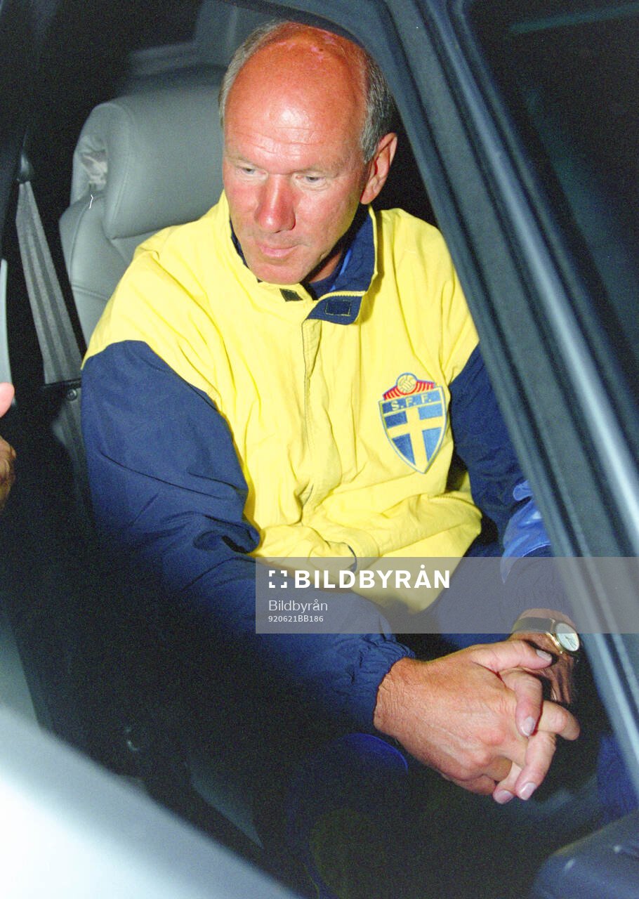 Swedens manager Tommy Svensson talks to the press sitting