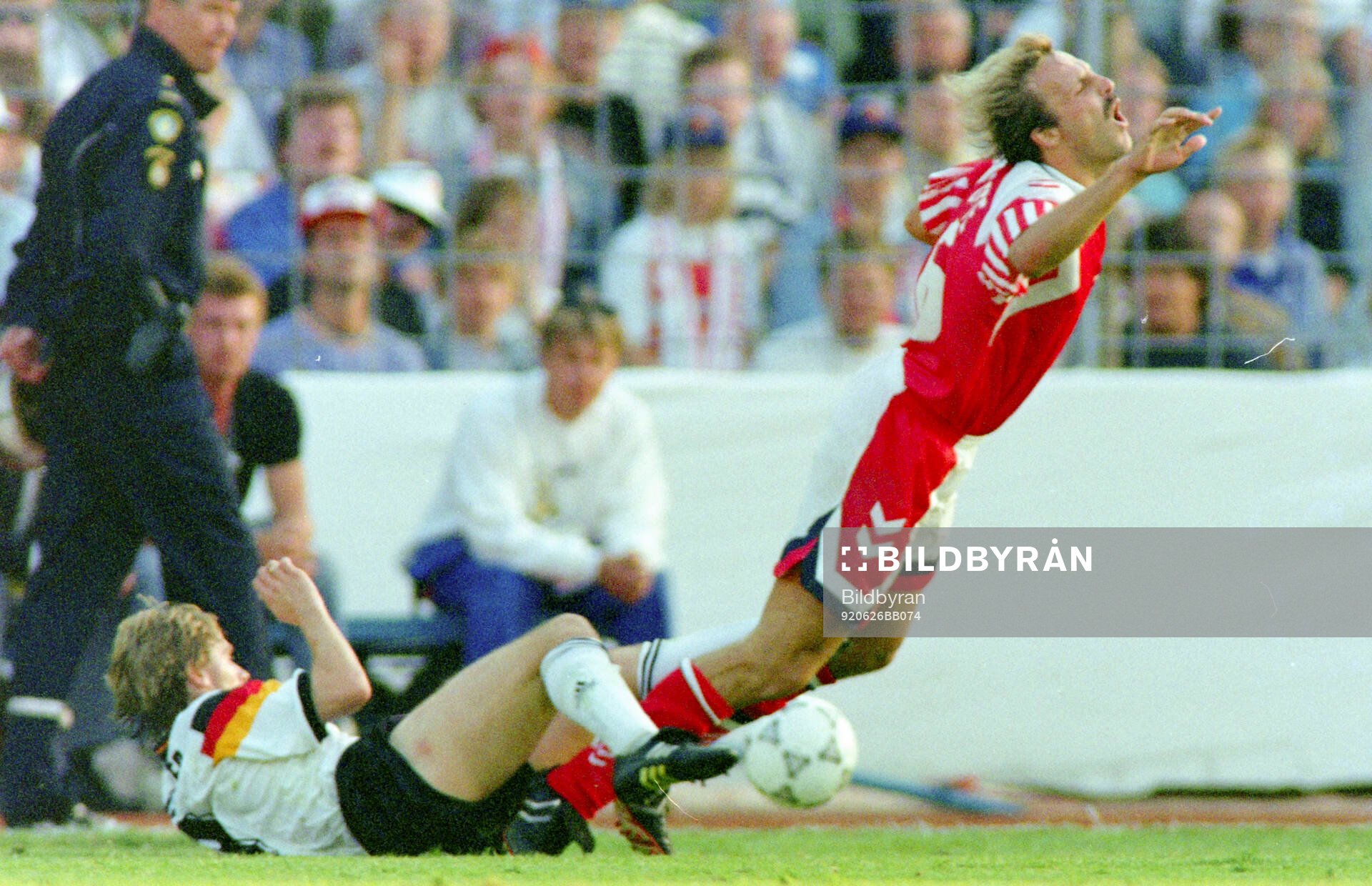 Denmarks Kim Christofte is tackled by Germanys Thomas