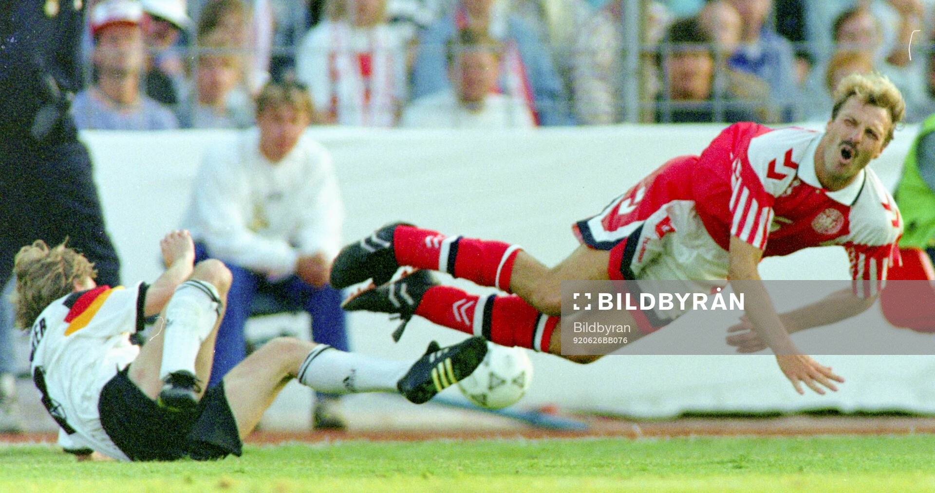 Denmarks Kim Christofte is tackled by Germanys Thomas