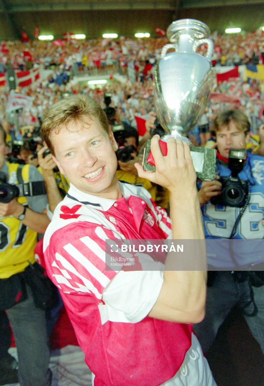 Denmarks John Sivebaek celebrates with the trophy