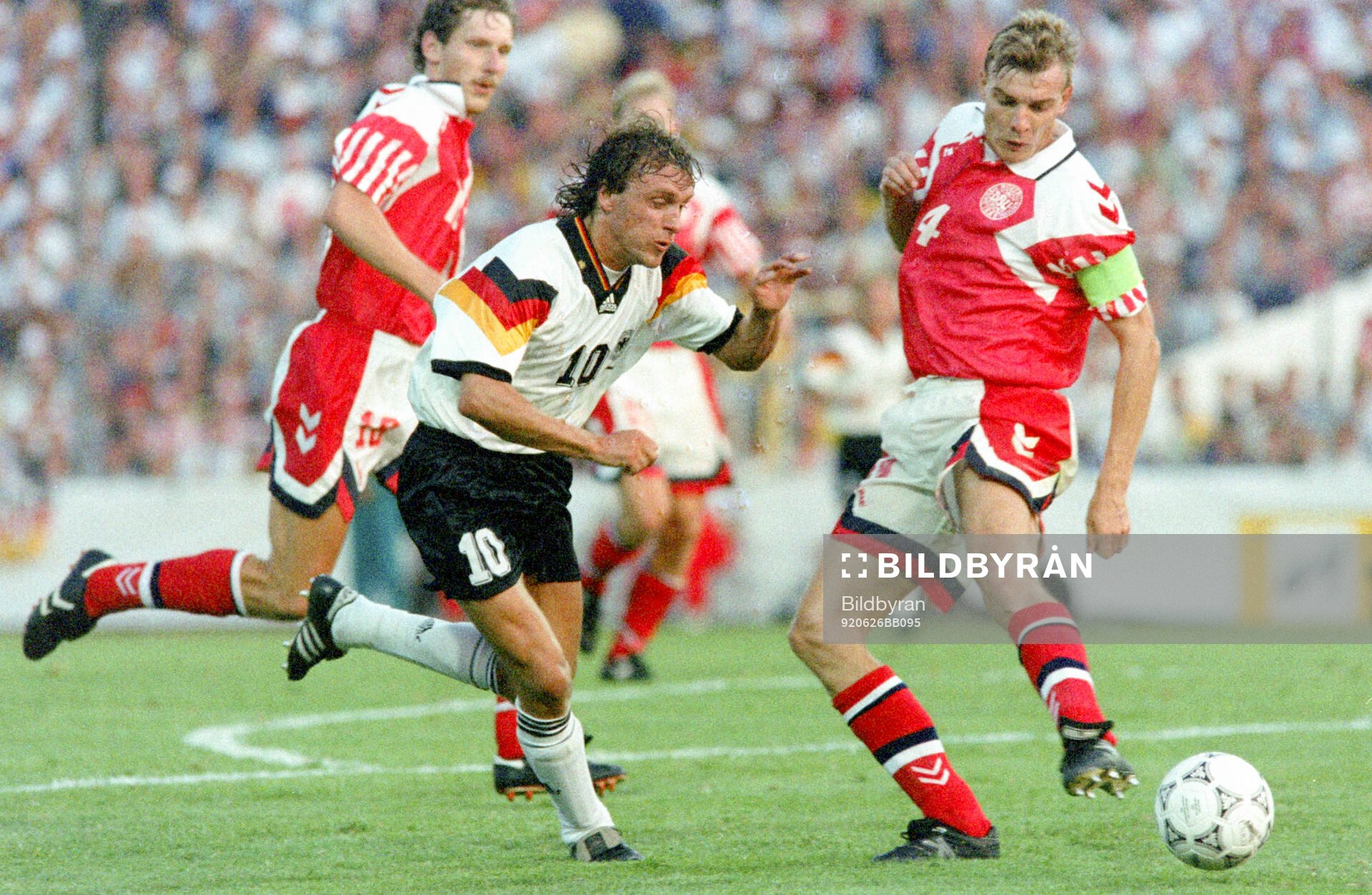 Germanys Thomas Doll (L) against Denmarks Lars Olsen