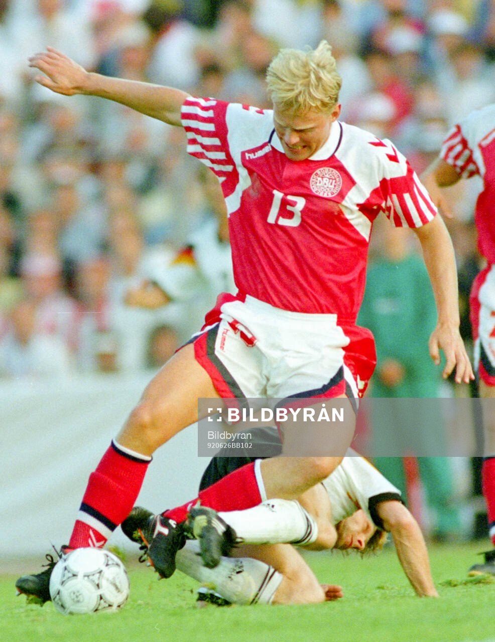 Denmarks Henrik Larsen tussles with Germanys Thomas Hassler