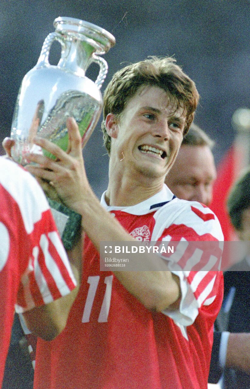 Denmarks Brian Laudrup celebrates with the trophy