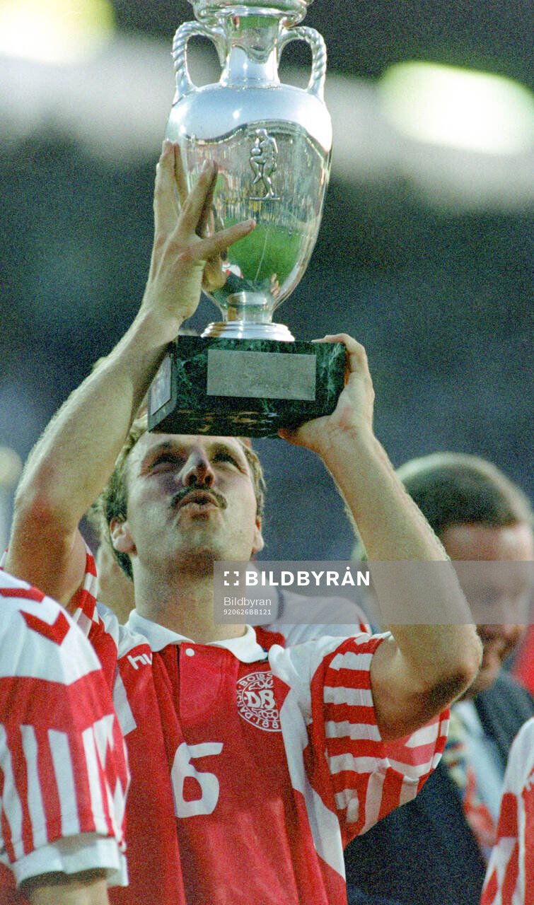 Denmarks Kim Christofte celebrates with the trophy