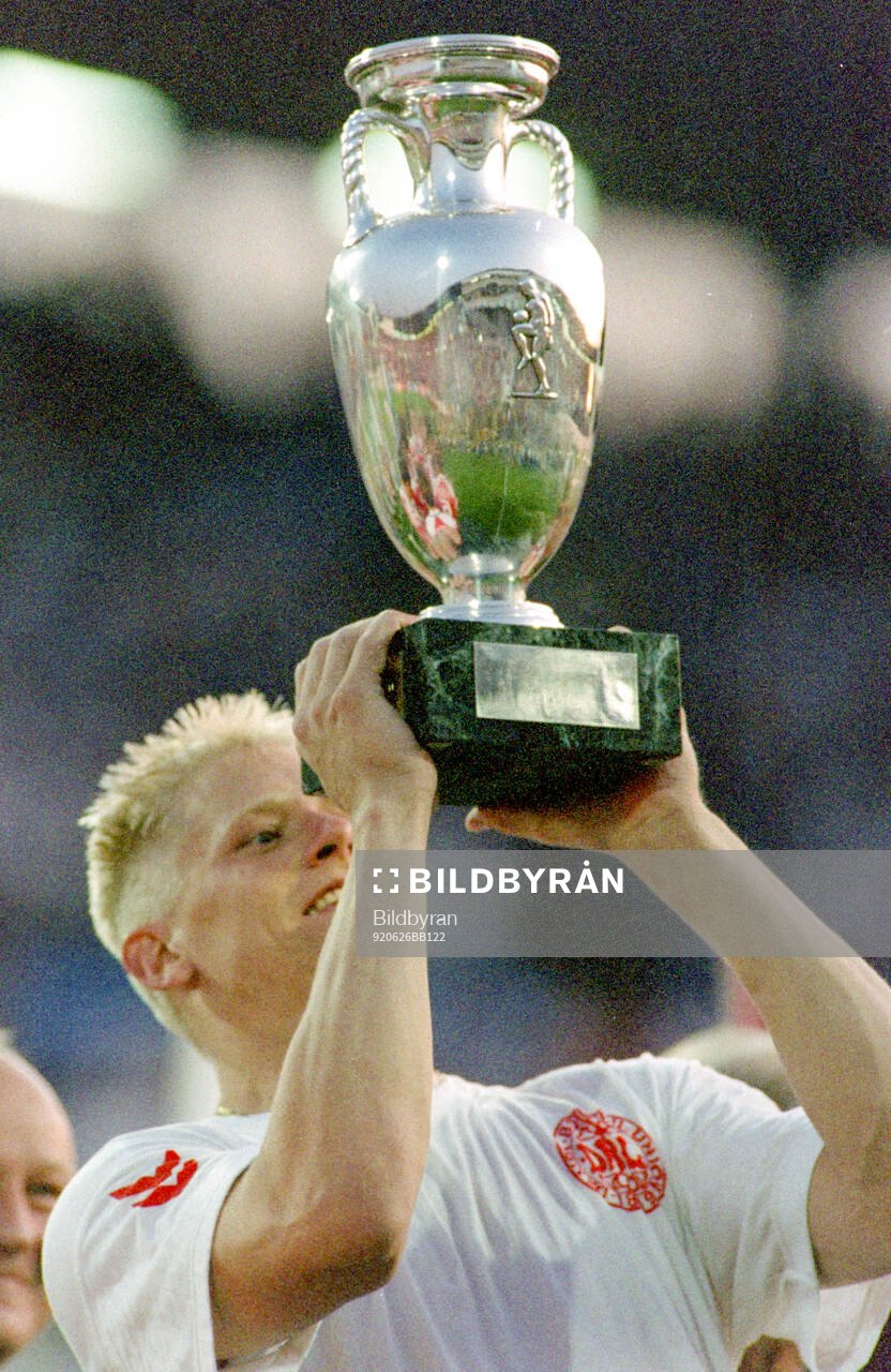 Denmarks Peter Schmeichel celebrates with the trophy