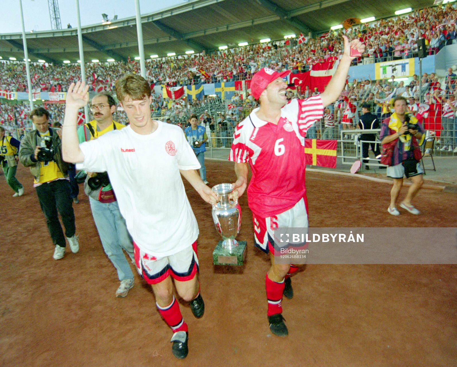 Denmarks Brian Laudrup and Kim Christofte celebrates with
