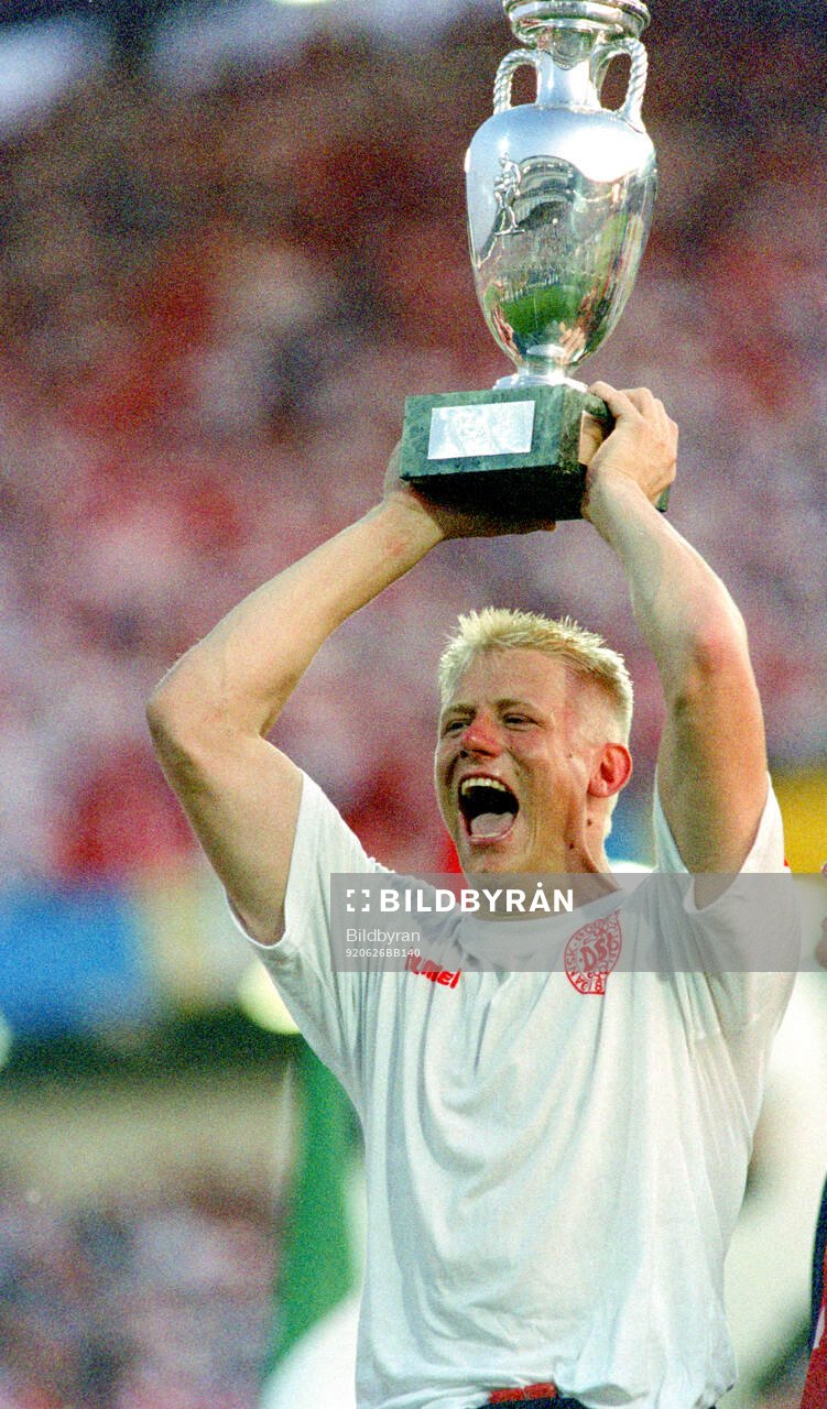 Denmarks Peter Schmeichel celebrates with the trophy