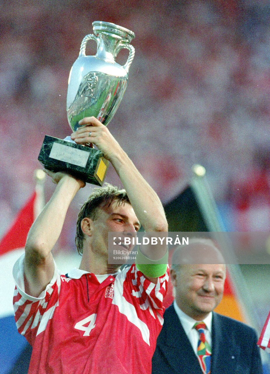 Denmarks captain Lars Olsen celebrates with the trophy