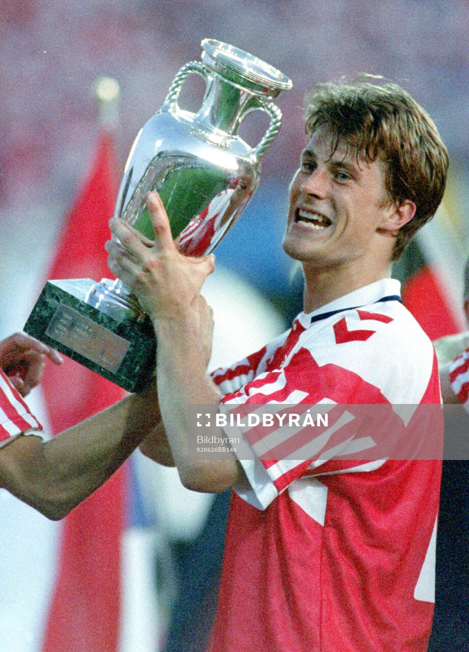 Denmarks Brian Laudrup celebrates with the trophy