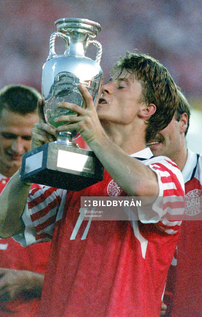 Denmarks Brian Laudrup celebrates with the trophy