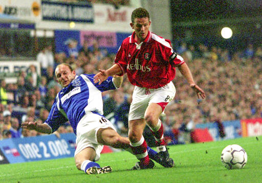 Charltons Mark Kinsella is tackled by Evertons Paul
