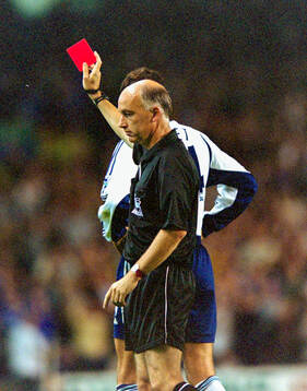  Referee David Elleray showing the red card.