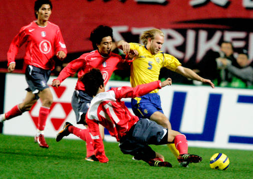  Mikael Dorsin, Sverige och Dong Jin Kim (3) Hwan Jung Ahn (19) och Ho Lee, (17) Sydkorea.