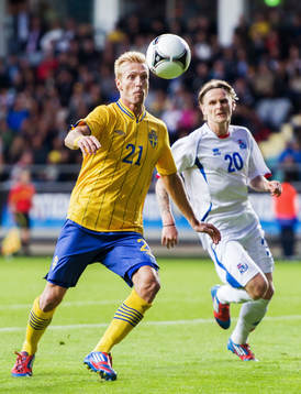 Christian Wilhelmsson, Sverige. I bakgrunden Ari Freyr