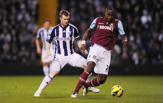 Football - West Bromwich Albion v West Ham United - Barclays Premier League  - The Hawthorns - 16/12/12 West Brom's Chris Brunt in action with West Ham's Guy Demel (R)