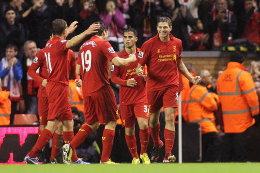  Football - Liverpool v Fulham - Barclays Premier League - Anfield - 22/12/12 Steven Gerrard (R) celebrates with team mates