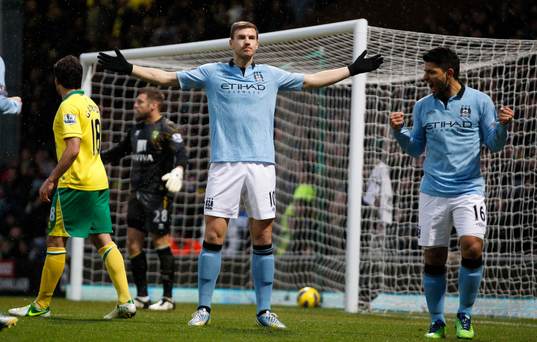  Football - Norwich City v Manchester City - Barclays Premier League  - Carrow Road - 29/12/12 Edin Dzeko celebrates scoring Manchester City's second goal with Sergio Aguero (R)
