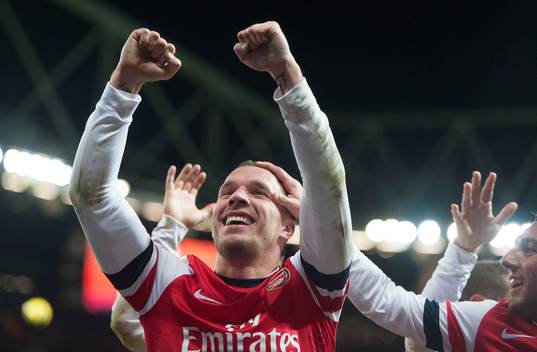  Football - Arsenal v Newcastle United - Barclays Premier League  - Emirates Stadium - 29/12/12 Lukas Podolski celebrates scoring Arsenal's third goal with team mates