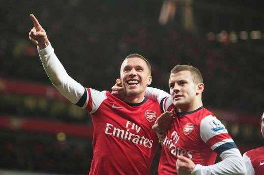  Football - Arsenal v Newcastle United - Barclays Premier League  - Emirates Stadium - 29/12/12 Lukas Podolski celebrates scoring Arsenal's third goal with Jack Wilshere (R)