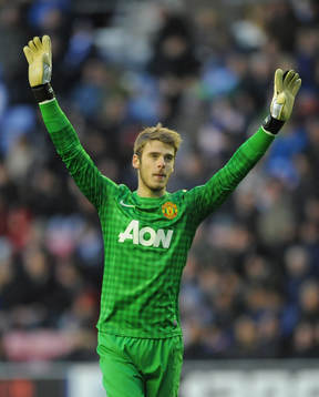  Football - Wigan Athletic v Manchester United - Barclays Premier League - DW Stadium - 1/1/13 Manchester United's David De Gea celebrates their second goal scored by Robin van Persie (not pictured)