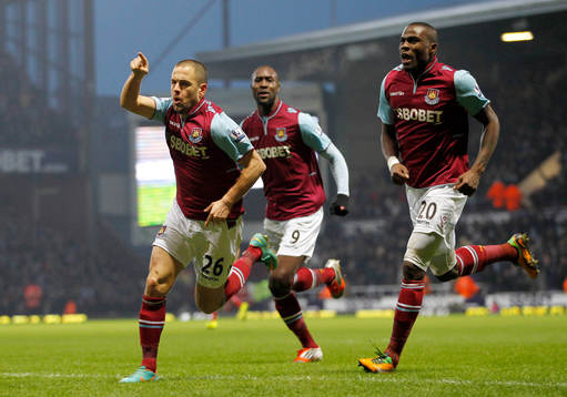 l - West Ham United v Queens Park Rangers - Barclays Premier League  - Upton Park - 19/1/13 West Ham United's Joe Cole celebrates scoring the first goal with Guy Demel and Carlton Cole