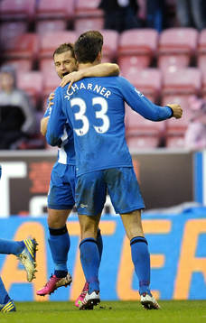 l - Wigan Athletic v Southampton - Barclays Premier League  - DW Stadium - 2/2/13 Shaun Maloney celebrates with Paul Scharner (R)