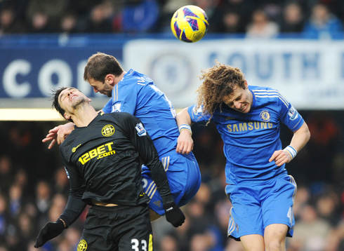 l - Chelsea v Wigan Athletic - Barclays Premier League - Stamford Bridge - 9/2/13 Paul Scharner (L) of Wigan in action with Branislav Ivanovic (C) and David Luiz of Chelsea