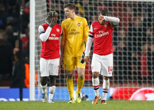 l - Arsenal v Bayern Munich - UEFA Champions League Second Round First Leg - Emirates Stadium, London, England - 19/2/13  Arsenal's Bacary Sagna, Wojciech Szczesny and Theo Walcott dejected