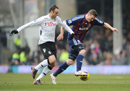 l - Fulham v Stoke City - Barclays Premier League  - Craven Cottage - 23/2/13 Fulham's Dimitar Berbatov (L) in action with Stoke's Robert Huth