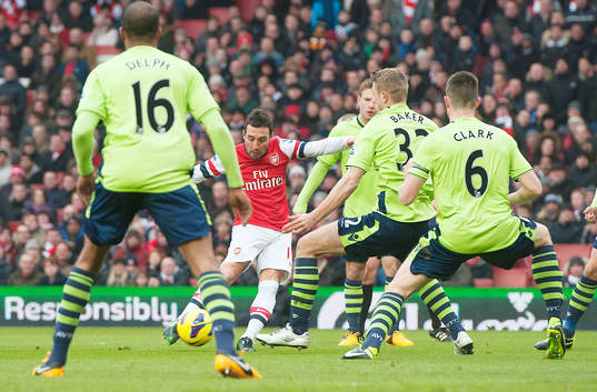 l - Arsenal v Aston Villa - Barclays Premier League  - Emirates Stadium - 23/2/13 Santi Cazorla (2nd L) scores the first goal for Arsenal