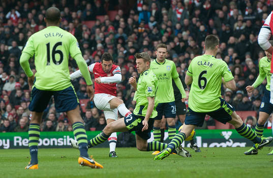 l - Arsenal v Aston Villa - Barclays Premier League  - Emirates Stadium - 23/2/13 Santi Cazorla (2nd L) scores the first goal for Arsenal