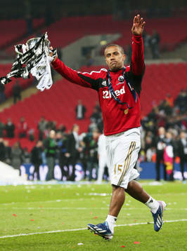 l - Bradford City v Swansea City - Capital One Cup Final - Wembley Stadium - 24/2/13 Swansea City's Wayne Routledge celebrates winning the Capital One Cup with the trophy