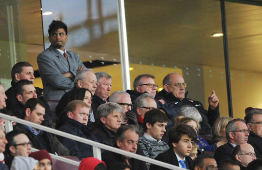  Football - Arsenal v Everton - Barclays Premier League  - Emirates Stadium - 16/4/13 Manchester United manager Sir Alex Ferguson (Top Centre) and former footballers Steve Staunton (Bottom L) and John Lukic watch from the stands