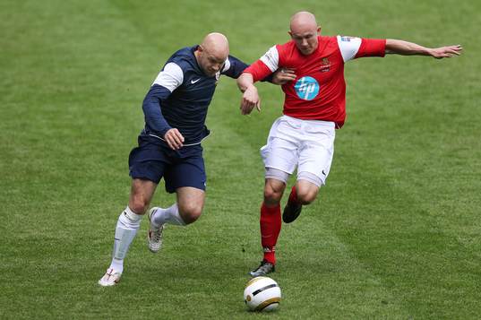 l - Army FA v FA Legends - The Madejski Stadium - 18/5/13 FA Legends' Danny Mills in action with Army FA's Keith Emmelson (R) in action