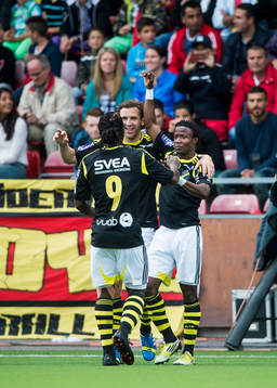 s Kennedy Igboananike firar sitt 1-0 mål tillsammans med Martin Kayongo-Mutumba och Nils-Eric Johansson i den allsvenska matchen mellan Syrianska och AIK den 14 juli 2013 i Södertälje.